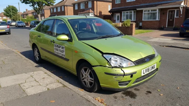 Accident damaged written-off car parked on a Manchester street ready to be scrapped